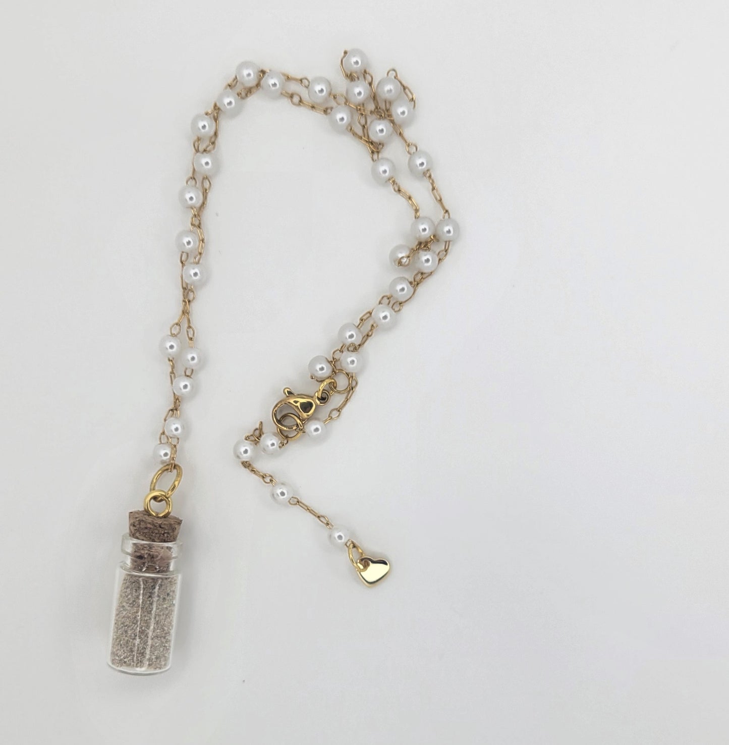 Collar de botellita con arena