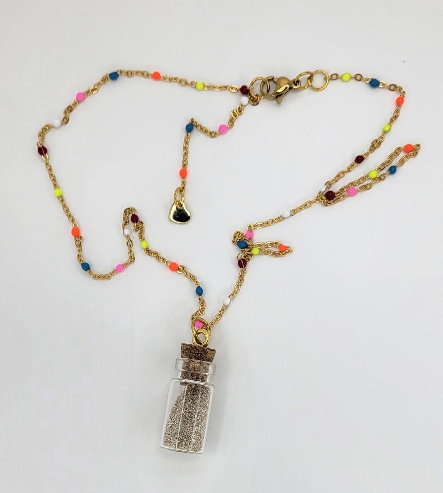 Collar de botellita con arena